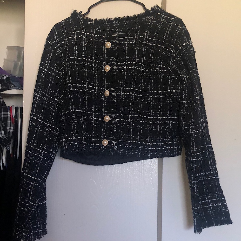Black cropped jacket with white detail. Never been worn.
